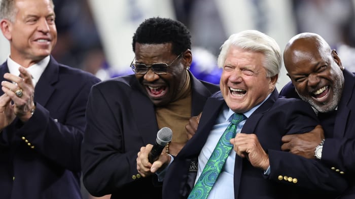 Cowboys Troy Aikman, Michael Irvin and Emmitt Smith flank former coach Jimmy Johnson